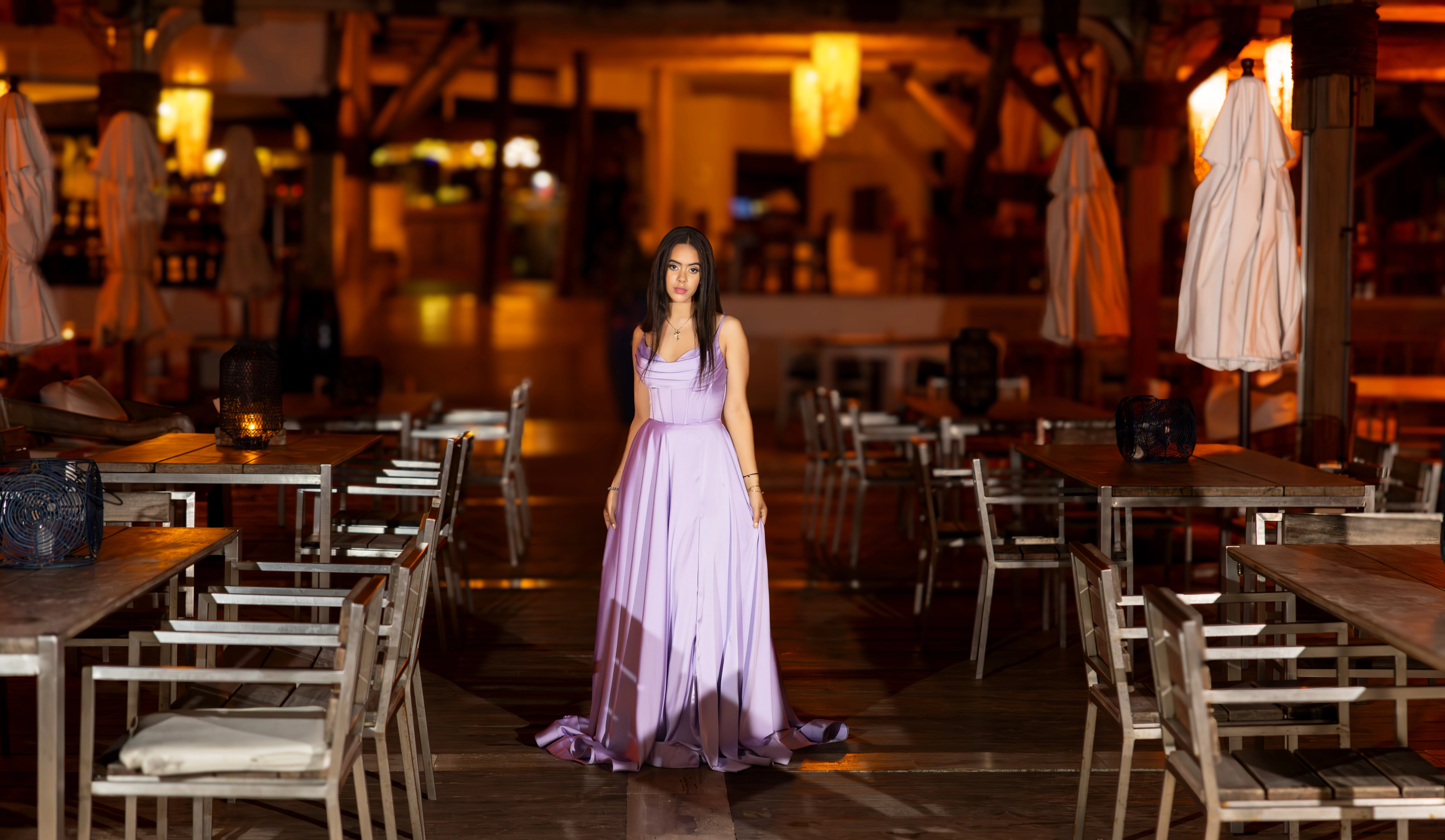 Quinceañera in a themed photoshoot with creative lighting